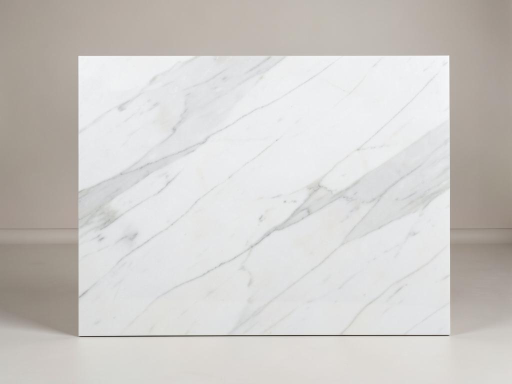 Carrara style quartz countertop material with soft white surface and light gray veining